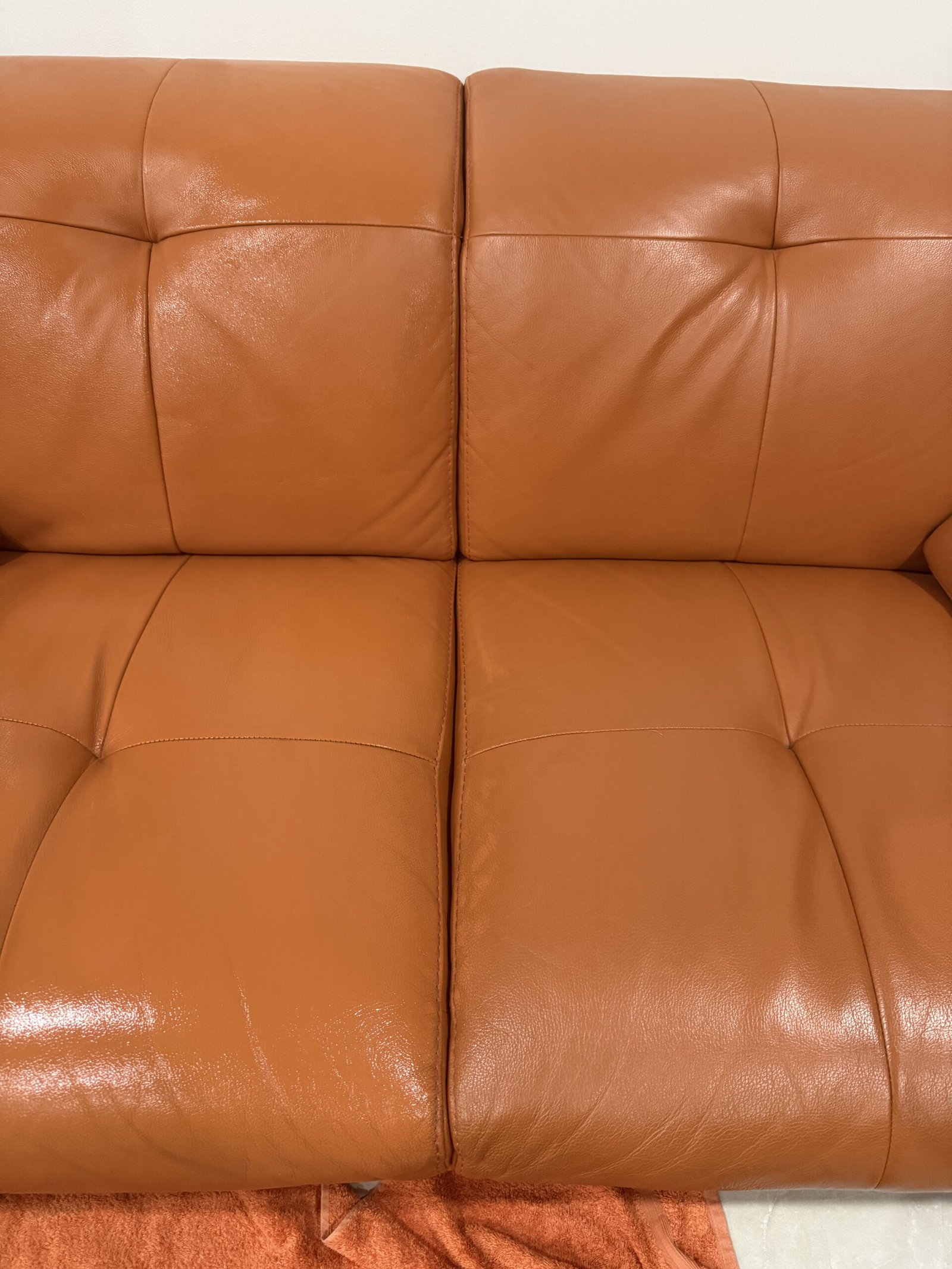 Clean refreshed leather sofa backrest and seat