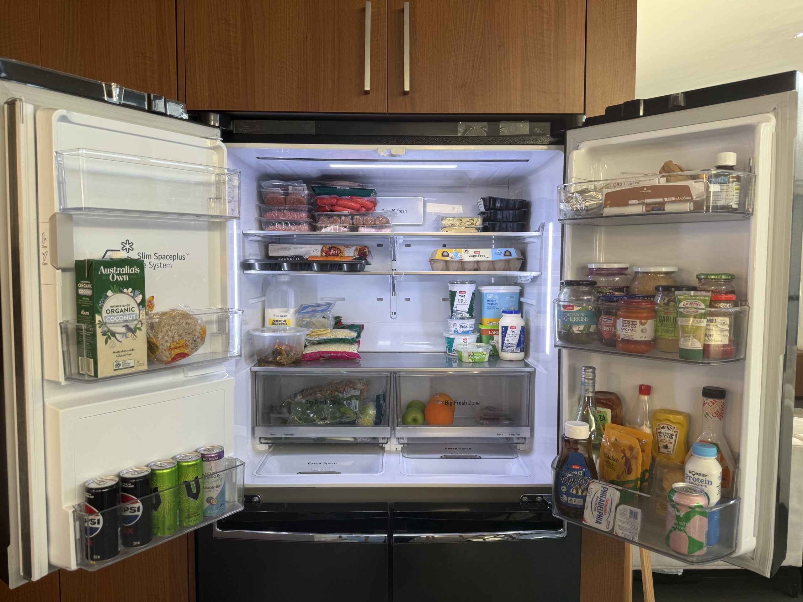 Fridge interior with groceries before cleaning service