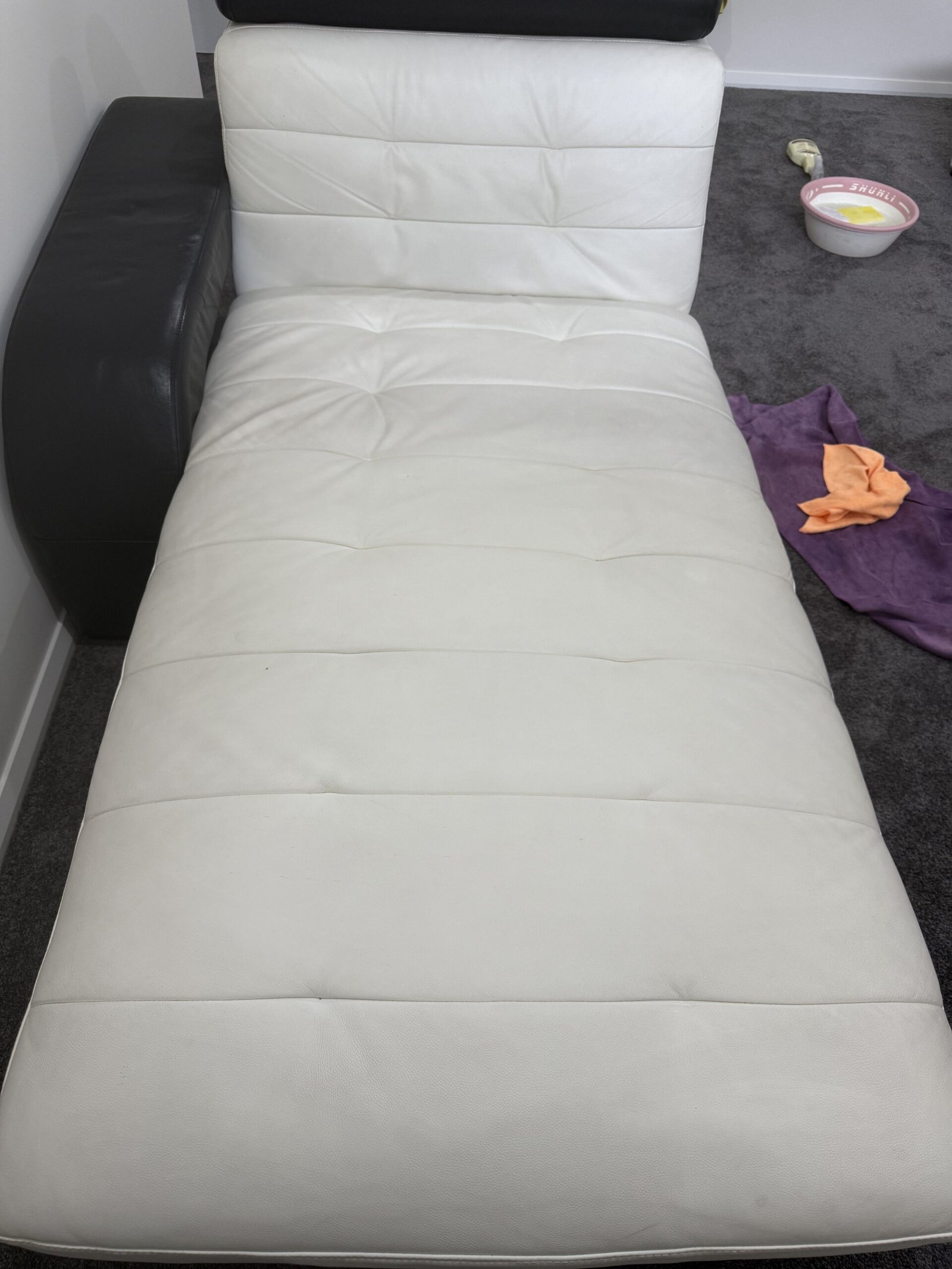 Leather chaise during stain removal treatment
